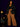 Lady Q’s Corner black double-breasted tailored blazer with gold buttons worn by a woman with brown wide-leg trousers