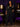 Lady Q’s Corner black high-waisted tailored flare trousers worn by a woman with a black leather jacket and heels