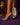 Lady Q’s Corner clear strap stiletto mule sandals with a vibrant floral printed sole on a purple background.