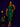 Lady Q’s Corner emerald green sleeveless sequin midi dress with a side slit worn by a woman against a purple wall.