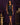 Lady Q’s Corner sleeveless black mini dress with a faux leather bodice and tailored skirt on a model