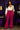 Lady Q’s Corner magenta high-waisted flare trousers with double-button detail worn by a woman in a satin blouse