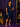 Lady Q’s Corner navy blue sequin midi dress with cold-shoulder cutouts, flutter sleeves, and a front slit on a model.