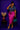 Lady Q’s Corner paisley print button-down shirt tied at the waist, worn with a fuchsia satin midi skirt and teal heels.