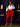 Lady Q’s Corner red high-waisted leggings worn by a woman with a white tied shirt and black heels in a luxury room