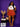 Lady Q’s Corner rust-orange pleated mini skirt with pockets, worn by a woman with a white graphic tee and gold heels.